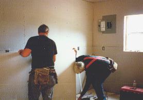 Carl and Jim working on sheetrock