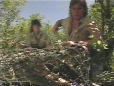 Steve and Terri attempting to remove croc from trap