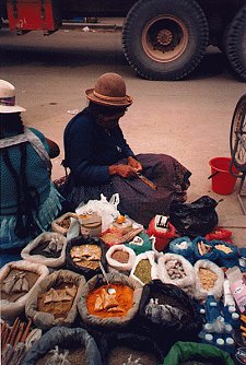 bowler hat lady selling spices in the streets of La Paz