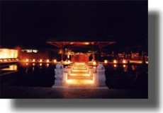 Night view of stepping stones leading to Pool Grill