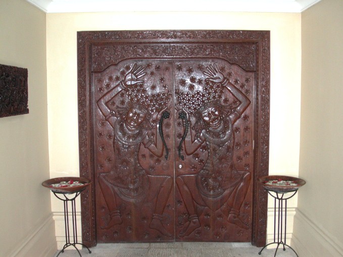 View of the carved timber doors leading to the Thallasso Health Spa courtyard at the Le Meridien Hotel at Bali Nirwana Resort.