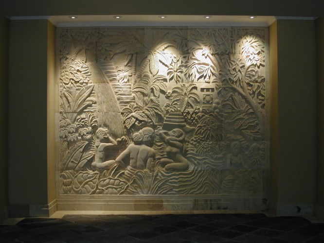 Night view of stone carved wall relief in the Entrance Lobby of the Thalasso Health Spa at Bali Nirwana Resort
