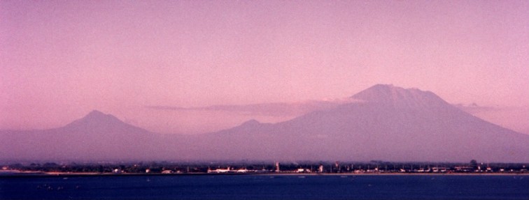 View of Gunung Agung from Jimbaran Bay with airport in foreground