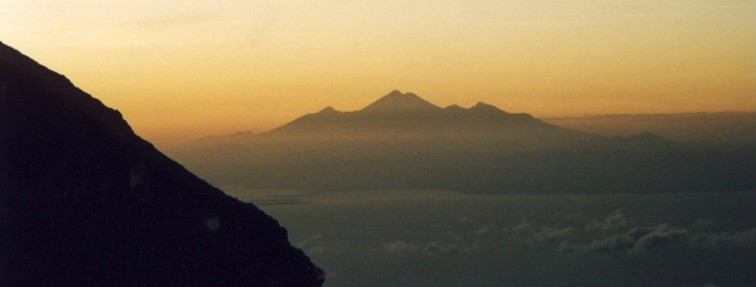 View of Lombok and Gunung Rinjani from Gunung Agung's crater edge at sunrise