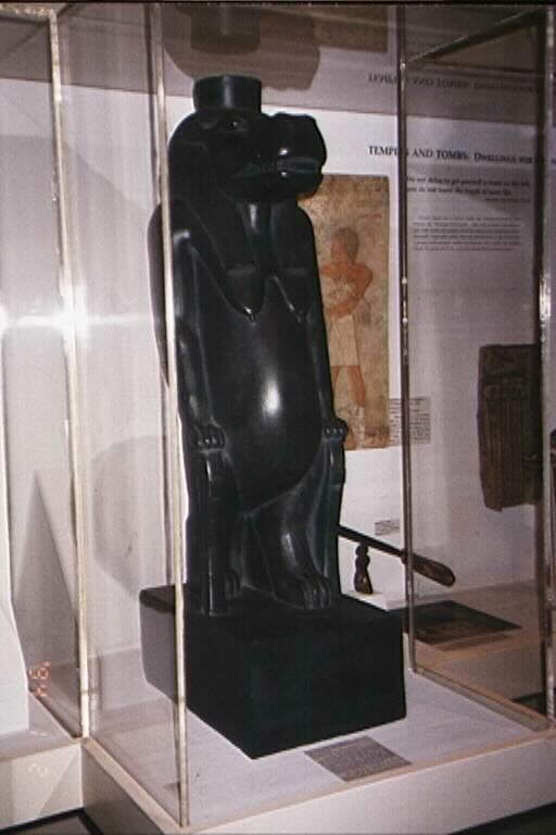 On the opposite side of the gallery, royalty and divinity are especially represented in sculptures. From the diminutive representations of deities such as a bronze cat symbolizing the goddess Bastet, to the large image of Taweret, patroness of expectant mothers, the importance of religion in the everyday life of the ancient Egyptians can begin to be appreciated.