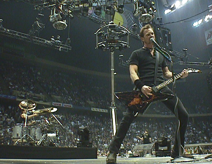 Very nice photo of Metallica in action Live in Concert.