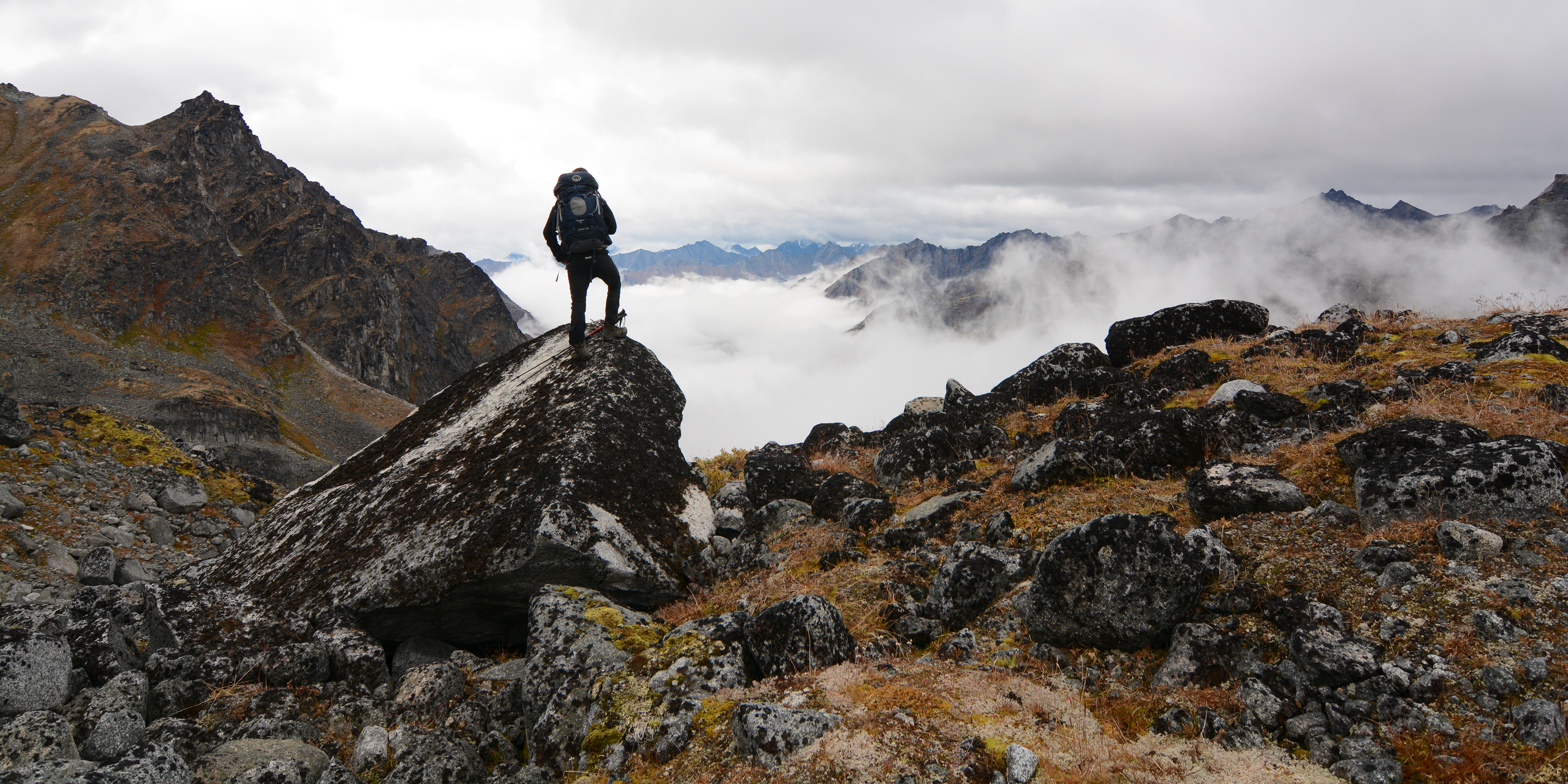 hiker standing on rock