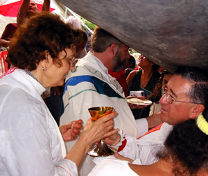 Kay reciving communion from Bishop Mart&iacute;n