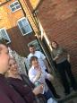 Squiffy photo of people smiling outside