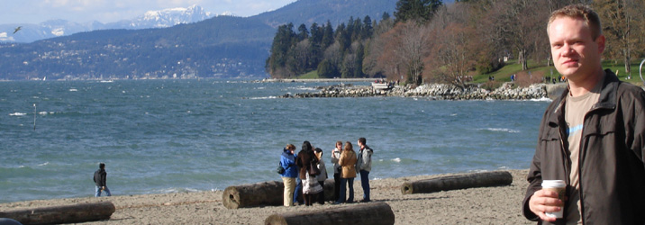 Adam having coffee at English Bay Beach on 11 March 2006