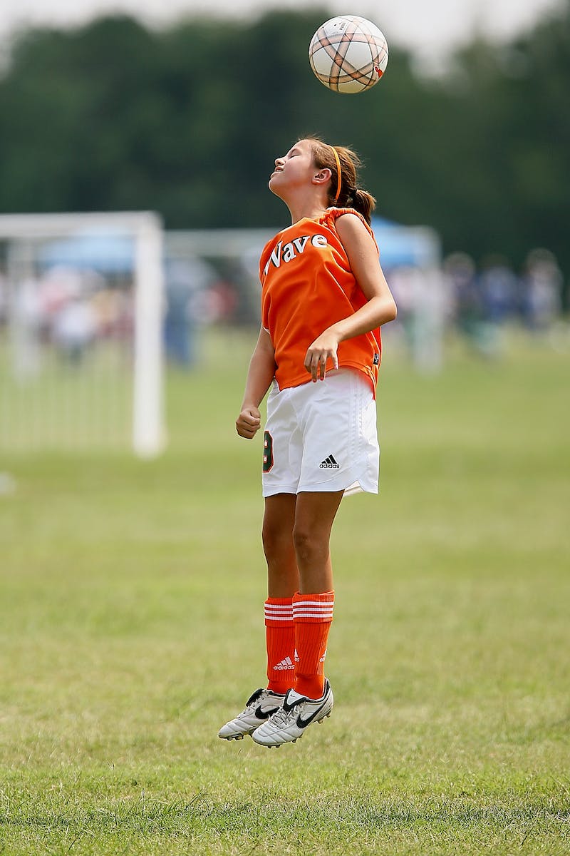 Young girl playing soccer