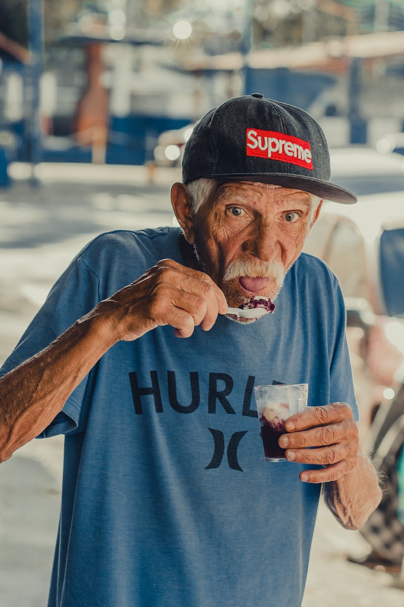 Old gentleman dripped out eating icecream