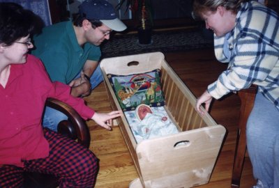 Paola, Pat, Alex, and Cass admiring my workmanship on the cradle.