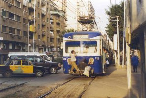 Free riders on the rear of an Alexandria Tramways train, Roushdy, December 1999.