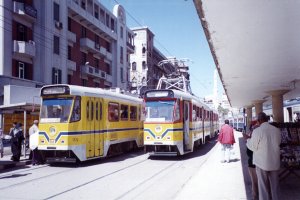 [#128 running as Line #15 and #1113 running as Line 25 at Ramleh Station, Alexandria, Egypt in April, 2001.]