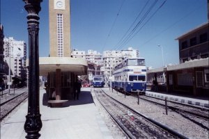 [Two trains running as #2 Line on the Sidi Gaber division pass at Sporting in April, 2001.]