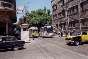 ex-Copenhagen tram and Alexandria city bus traveling in tandem on Sidi al-Dardaa Street near St. Catherine Circle. April 2001.