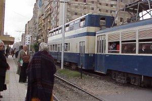 Train and passengers near Sporting Club.