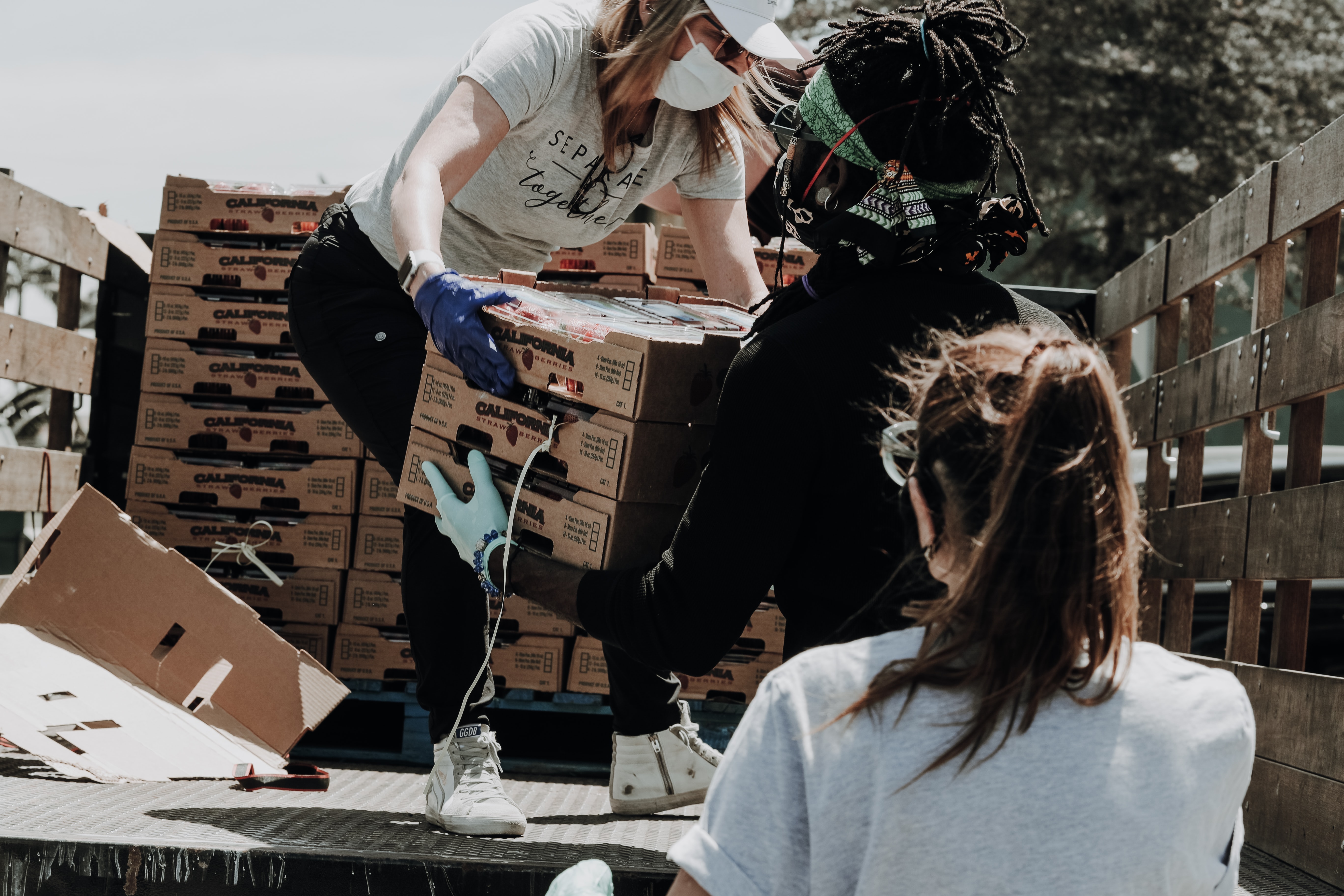 employees brigning shoes to needy children