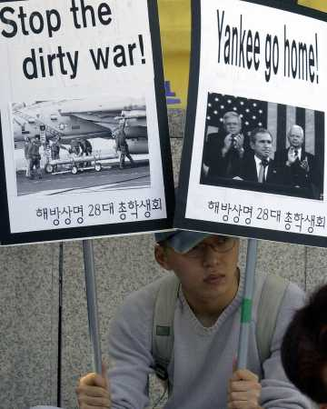 Protests against the coming war have happened all over the world; this man is demonstrating in in front of the U.S. embassy in South Korea.