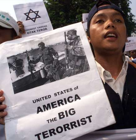 Protests against the coming war have happened all over the world; this man is demonstrating in in front of the U.S. embassy in Indonesia.