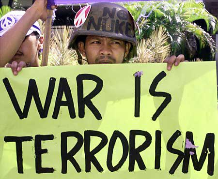 Protests against the coming war have happened all over the world; this man is demonstrating in the Phillipines.