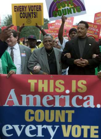 Jesse Jackson marches in protest
