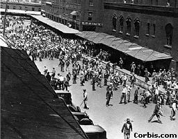 Workers vs cops who were trying to bring in scabs through the City Market in Minneapolis. Onlookers cheer them on as the cops get a taste of their own medicine.