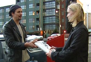 Jane receives her morning paper from Frank