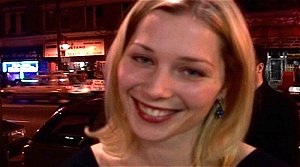 Stefanie von Pfetten outside Federico's Supper Club with Pronta Moda Hair Studio and Turistano International Travel in the background across the street.