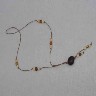Colar um fio com semente de jatob� e a�a�