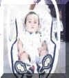 cous_in_babychair.jpg (112228 bytes)
