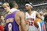 ... and Kobe Bryant sportingly congratulates Rip Hamilton ...
