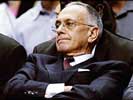 ... as Detroit's coach Larry Brown looks on ...