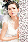 Candy Lo posing in wedding gown