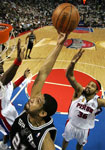 Duncan scores 26 and grabs 19 rebounds ... agasinst the Wallaces.