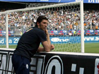 Buffon watches from behind the banners in the Juventus goal