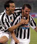 Zambrotta celebrates with goalscorer Del Piero after he makes it 2-0.