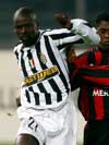 Juventus' Thuram being hounded by Milan's Seedorf