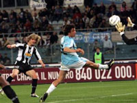 ... and watches the ball fly