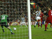 Cannavaro watches his header as Carson tries to make the save