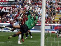 .. and Trezeguet flicks the header over a leaping Dida
