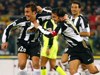 Juventus captain Del Piero celebrates Cannavaro's goal as Zambrotta watches