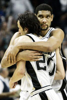 Duncan, with an intense look in his eyes, hugs Ginobili