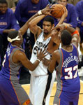 Duncan is double-teamed by Johnson and Stoudemire