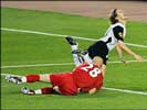 Marseille's goalkeeper Fabien Barthez brings down Valencia striker Mista