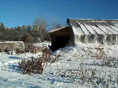 Evaluation garden and technological glasshouse covered with additional plastic layer