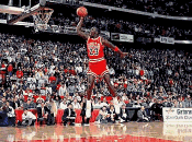 Jordan's perfect 50 free throw line dunk narrowly defeated Nique to defend his title