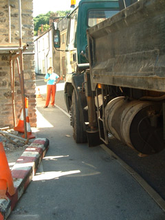 Woman facing lorry