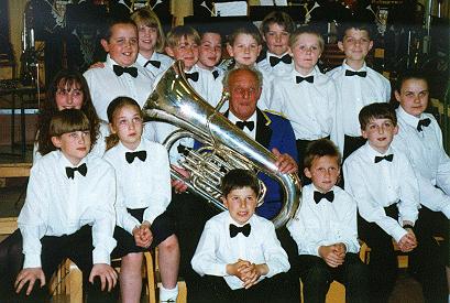 Photograph of Geroge Baker with members of the junior band